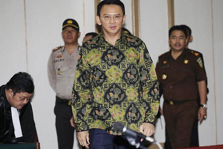 Jakarta Governor Basuki Tjahaja Purnama at his trial yesterday. Prosecutors said that while he should be found guilty of insulting Islam, his actions did not warrant prison time, and they recommended a two-year probation in lieu of a suspended one-ye