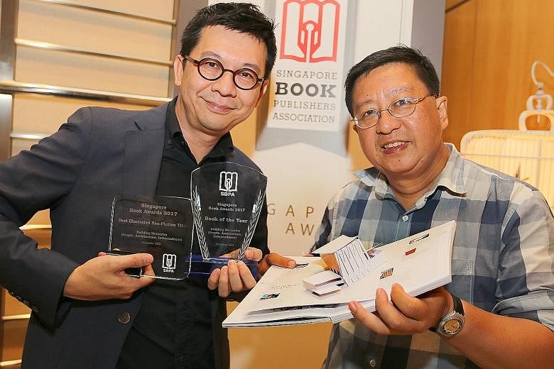 Publisher Yeo Yeok Chuan (left) and writer Lai Chee Kien with Building Memories, which won two prizes at the Singapore Book Awards.