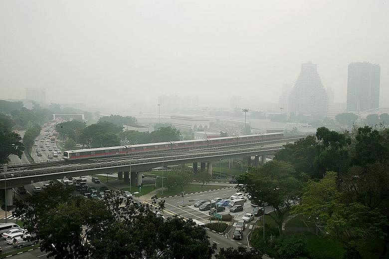 Hazy conditions in Bishan at 7am yesterday. The 24-hour PSI reached a high of 95 in southern Singapore at 8am and stayed in the moderate range across the island for the rest of the day.