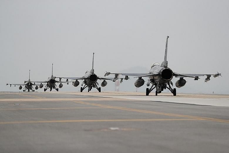 US Air Force F-16 Fighting Falcon fighter jets taking part in a bilateral training exercise at the Kunsan Air Base in South Korea on Thursday. US and South Korean officials have been saying for weeks that Pyongyang could soon stage another nuclear te