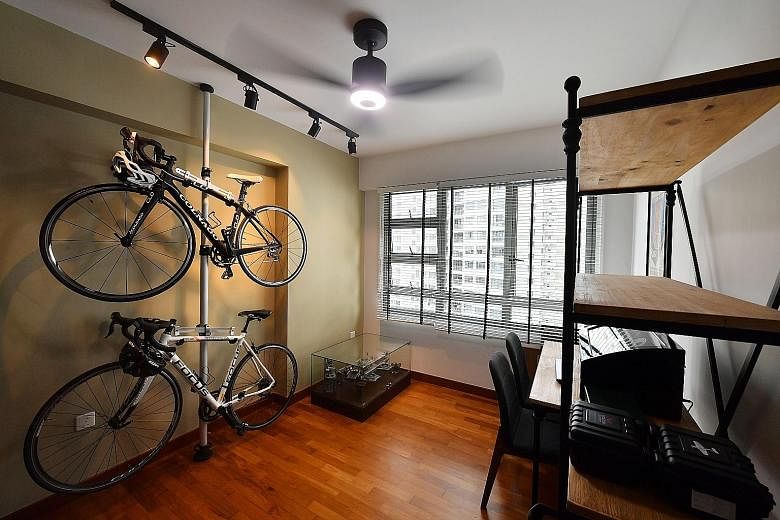 Bicycles are hoisted on a stand (above) in the study to maximise space and the master bedroom has a laidback vibe with its earthy palette.