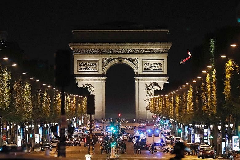 Dozens of emergency and security vehicles rushed to Paris' Champs Elysees on Thursday night after a gunman opened fire, killing a police officer and wounding two others. Security remains high in Paris after the shooting, ahead of the French president