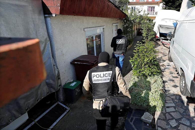 French police officers arriving at the home of the gunman in the eastern Paris suburb of Chelles. Three of his family members were taken into custody.