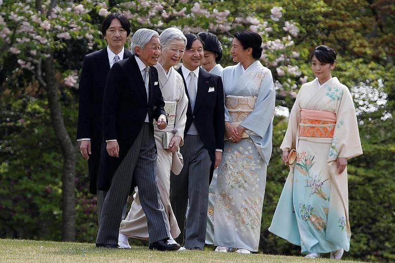 Emperor Akihito (foreground), flanked by Empress Michiko, with (from left) Prince Akishino, Crown Prince Naruhito, Princess Kiko, Crown Princess Masakoand Princess Mako at the annual spring garden party on Thursday.