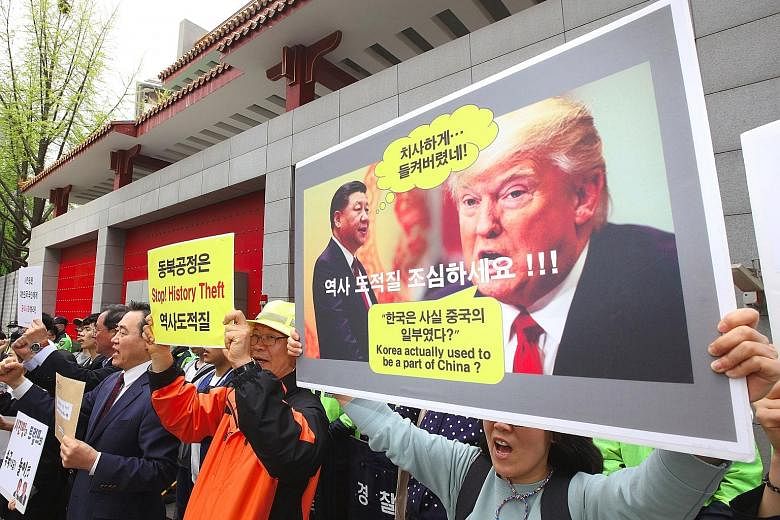 South Korean historians and activists protesting outside the Chinese Embassy in Seoul on Friday. The exact details of what Mr Xi Jinping said and whether Mr Donald Trump accurately quoted him are unknown.