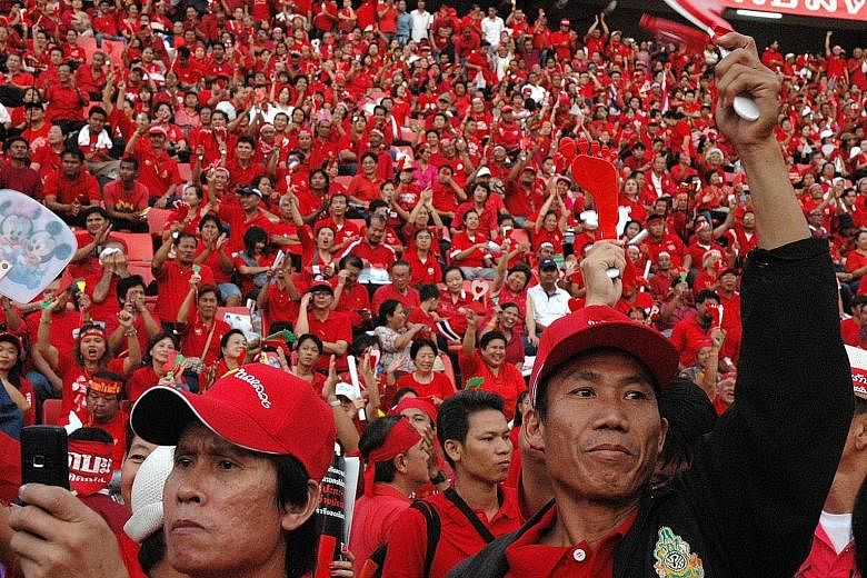 Unquiet Kingdom: Thailand In Transition is available at major bookstores and at stpressbooks.com. sg for $32, including GST. Thaksin supporters forming a sea of red at a Bangkok stadium in 2008. The class divide aspect of the political conflict began