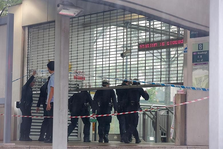 Policemen entering Woodleigh MRT station after it was closed due to a suspicious substance last Tuesday.