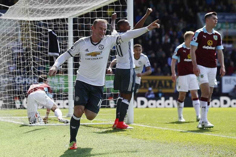 Wayne Rooney celebrating after scoring Manchester United's second goal in the 2-0 win against Burnley yesterday. In only his second league start of the year, he scored for his club for the first time since January.