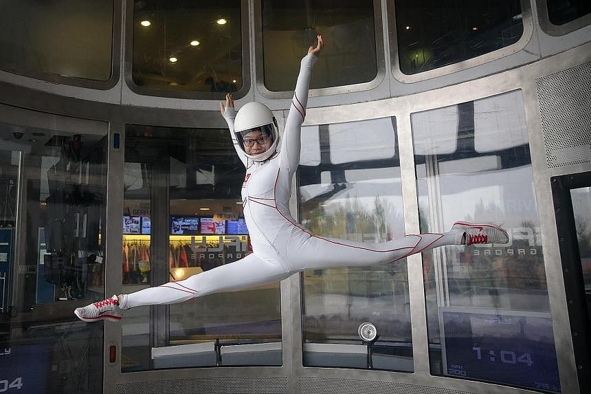 Kyra Poh, 14, perfecting her indoor skydiving technique in the wind tunnel at iFly Singapore. She was introduced to the sport when she was only eight years old and began competing a year later.
