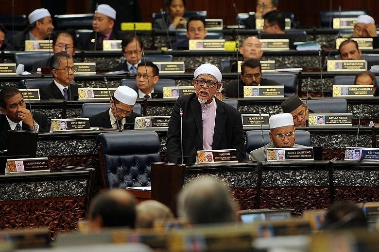 PAS president Abdul Hadi Awang tabling amendments to the Syariah Courts (Criminal Jurisdiction) Act in the Malaysian Parliament on April 6. The Speaker abruptly ended proceedings without allowing dissenting debate or a vote.
