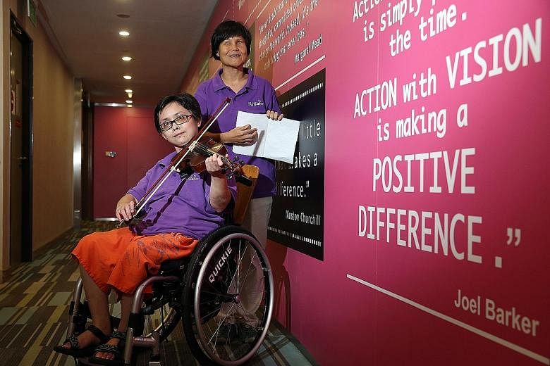 Violinist Huang Li Zhen, 29, who has lupus, and blind vocalist Wan Wai Yee, 44, are part of the 30-member Purple Symphony Ensemble. Singapore's largest disability- inclusive orchestra receives many performance requests, but it was challenging to arra