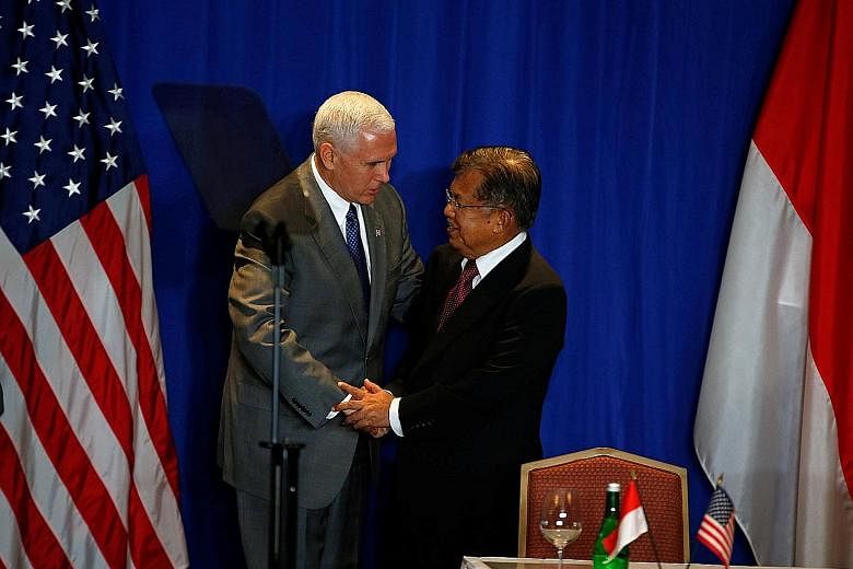 US Vice-President Mike Pence with his Indonesian counterpart Jusuf Kalla at a business forum in Jakarta on April 21.