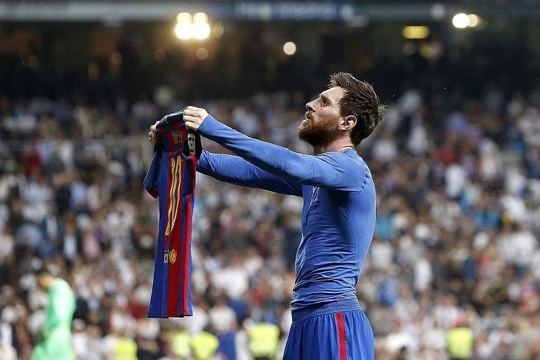 Barcelona talisman Lionel Messi posing with his jersey and silencing the baying Real Madrid fans with his 92nd-minute winner at the Santiago Bernabeu.