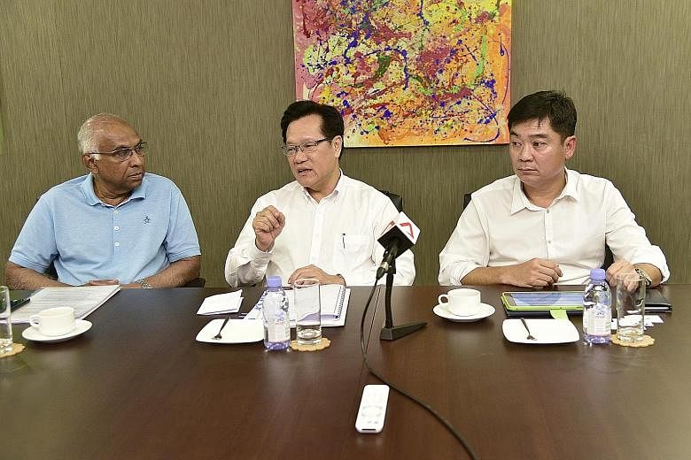 (From left) S. Thavaneson, Lim Kia Tong and Bernard Tan at a media briefing at Komoco Motors yesterday. If elected, they want to ensure that clubs with jackpot operations pump some of the profits back into the local game.