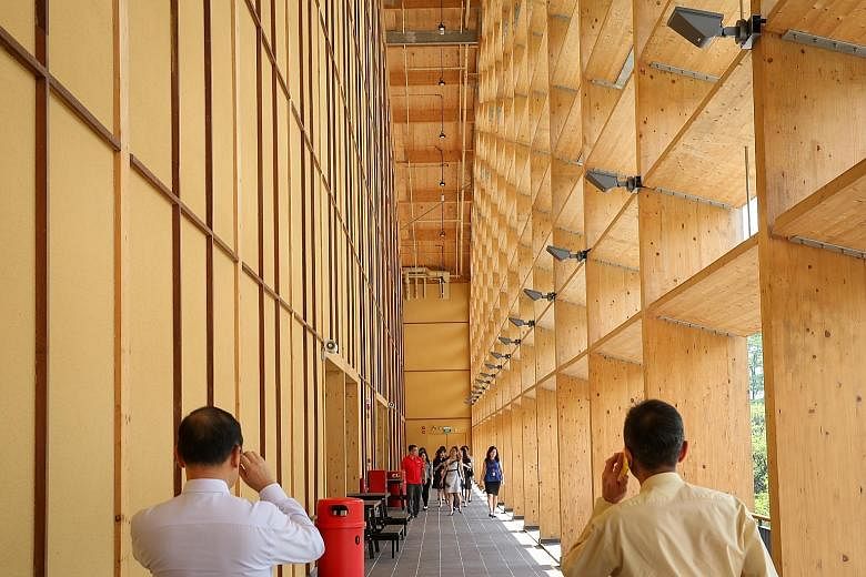 Nanyang Technological University's new sports hall, The Wave, is made mostly of mass engineered timber. Parts are prefabricated, speeding up construction.