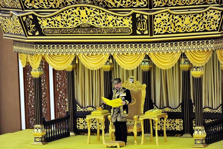 Kelantan's Sultan Muhammad V, seen here reading the Oath of Installation, was officially installed as the 15th Malaysian king yesterday under the country's unique royal rotation involving the nine Malay ruling houses. The installation ceremony, steep