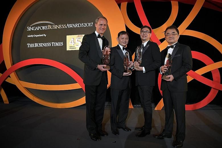 The winners of the Singapore Business Awards 2017 are (from left) Mr Heinrich Jessen, chairman of Jebsen & Jessen (SEA), Businessman of the Year 2016; Mr Goh Choon Phong, chief executive officer, Singapore Airlines Group, Outstanding Chief Executive 