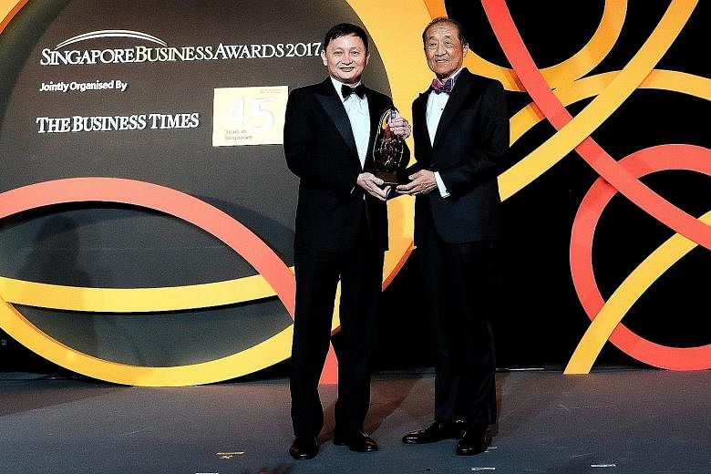 Singapore Airlines Group CEO Goh Choon Phong (left) receiving the Outstanding CEO of the Year award from judging panel chairman Stephen Lee. Mr Heinrich Jessen with his award last night. He was also lauded for his vision in transforming Jebsen & Jess