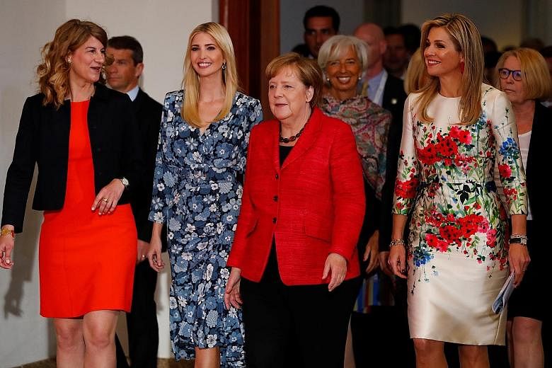 All set for the Women20 Summit in Berlin yesterday were (from left) Association of German Women Entrepreneurs president Stephanie Bschorr, US President Donald Trump's daughter Ivanka, German Chancellor Angela Merkel, International Monetary Fund manag
