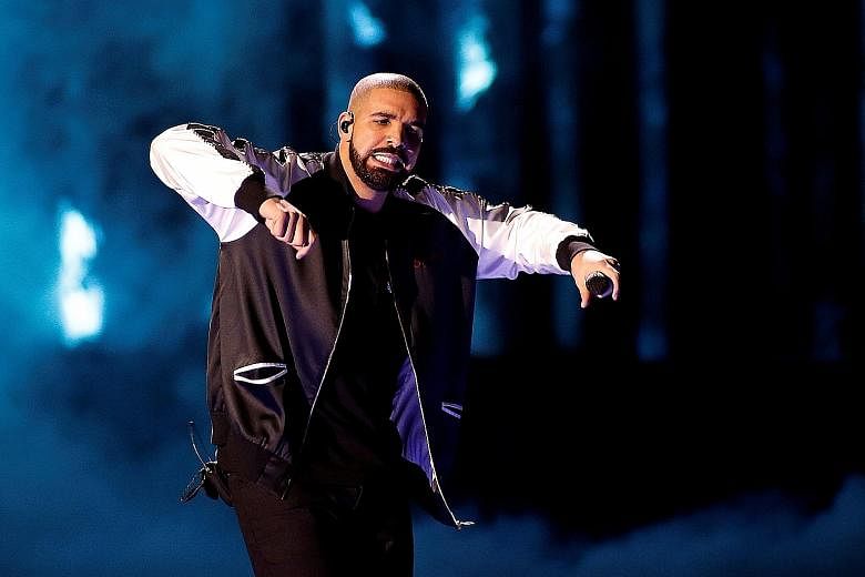Canadian rapper Drake was the top-selling artist as digital income accounted for half of the music industry's revenue for the first time.