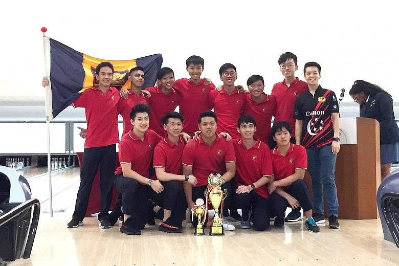 Anglo-Chinese Junior College's boys' bowling team celebrate capturing their fourth A Division title in five years with national bowler Shayna Ng, who handed the winners their trophies.