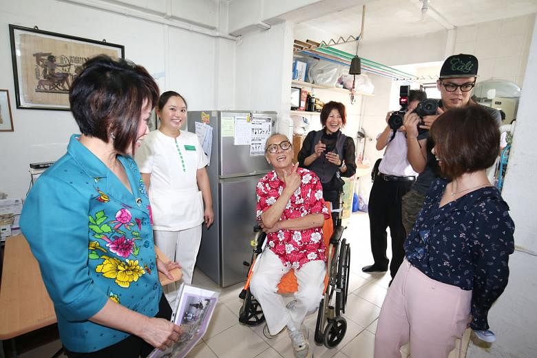 Mr Wong Ah Ann, 68, a beneficiary of a newly launched community care programme, sharing his experience with Dr Lily Neo (in light blue), an MP for Jalan Besar GRC, and Senior Minister of State for Health Amy Khor (far right). Yesterday, SingHealth Regiona