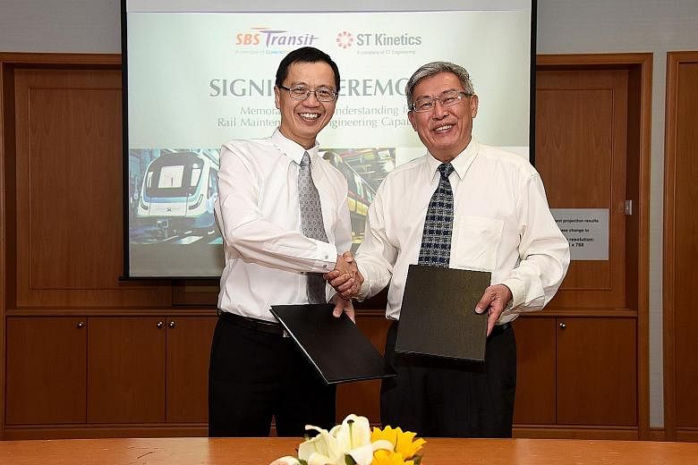 ST Kinetics president Lee Shiang Long (left) and SBS Transit chief executive officer Gan Juay Kiat at the memorandum of understanding signing ceremony on Wednesday.