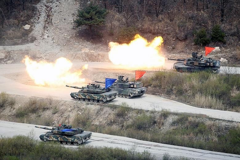 South Korean and US tanks in an exercise near the demilitarised zone in South Korea on April 21. As a middle power, South Korea cannot afford to alienate either China or the US, or even Japan. Militarily, it still depends on the US.