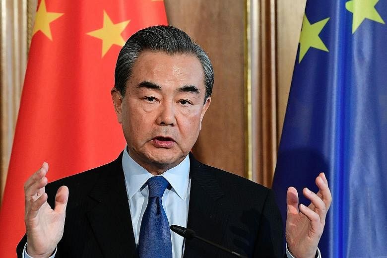 Chinese Foreign Minister Wang Yi, during a visit to Germany on Wednesday, points out that his country's businesses and citizens have spread around the world.