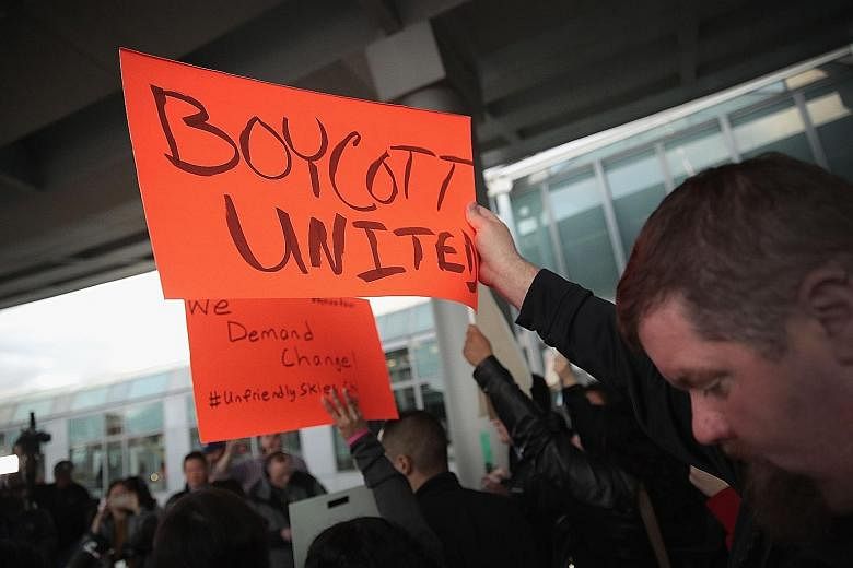 Demonstrators protesting against United Airlines outside Chicago O'Hare International Airport on April 11, after passenger David Dao (above) was dragged off an overbooked flight two days earlier due to the lack of volunteers willing to surrender thei
