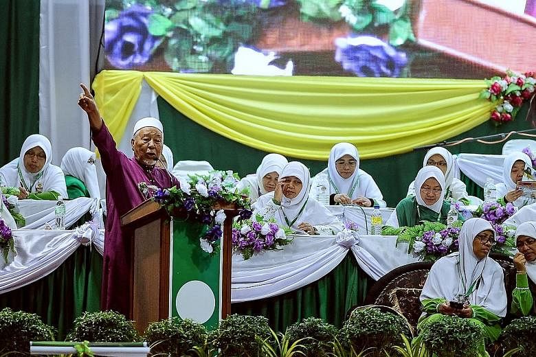 Parti Islam SeMalaysia spiritual leader Hashim Jasin speaking at the opening ceremony of the PAS Women's annual congress in Kedah yesterday. The party's outgoing Youth chief Nik Abduh Nik Aziz said that if PAS wins big at the general election, it cou