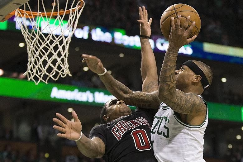 Boston Celtics guard Isaiah Thomas scoring against Isaiah Canaan of the Chicago Bulls during the vital run in the fourth quarter to win 108-97. Thomas, who had 24 points in the game, scored 11 of them in the last quarter to put the outcome beyond dou