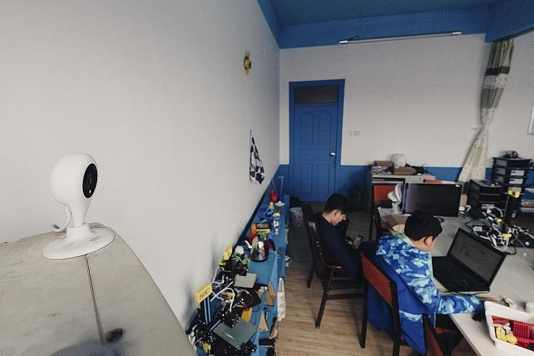 A live-streaming camera at the Deep Blue Children Robot Centre in Jimo, Shandong province. Thousands of schools in China are broadcasting their students live on public websites, crowdsourcing the task of supervision.