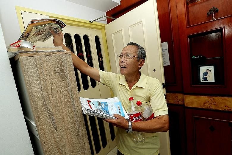 Retiree Peter Lo started a recycling drive in seven zones in his Sembawang neighbourhood that is still ongoing to this day. The items freelance writer Olivia Choong (above) collects in her home for recycling include used newspapers, milk cans and pla