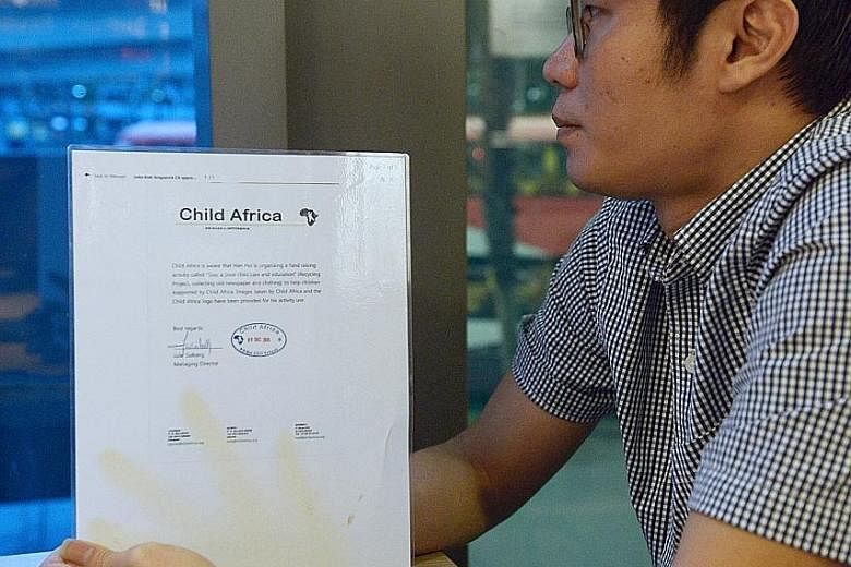 (Left) Mr Dave Wong with a letter issued by a charity called Child Africa to show it is aware of his donation drive.