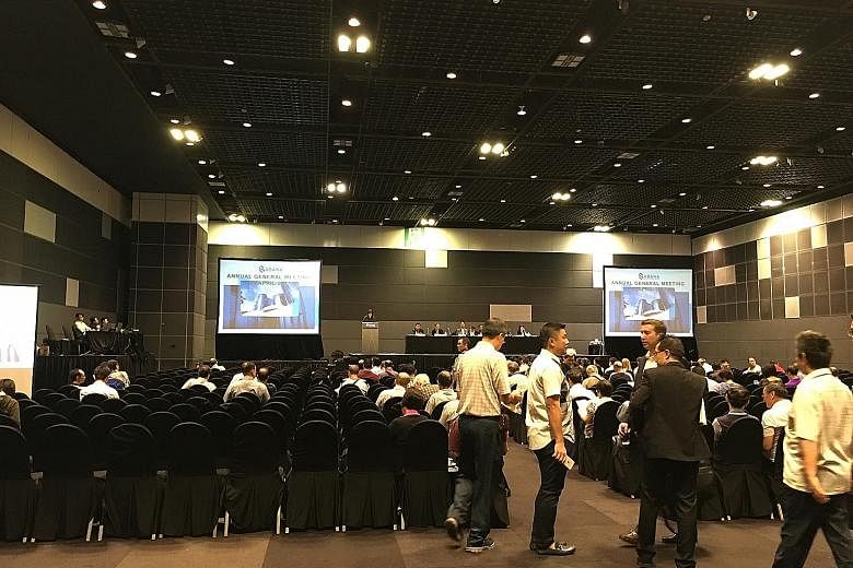 Investors at Hall 404 before the meeting started. On stage are the board members of Sabana Reit Management and a representative from the HSBC trustee.