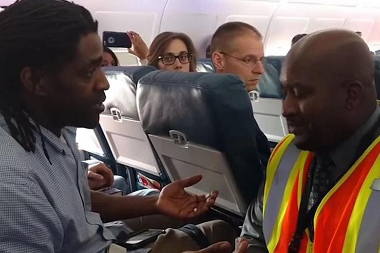 A video showing Mr Kima Hamilton talking to an agent during the April 18 incident on board a Delta Air Lines plane in the US.