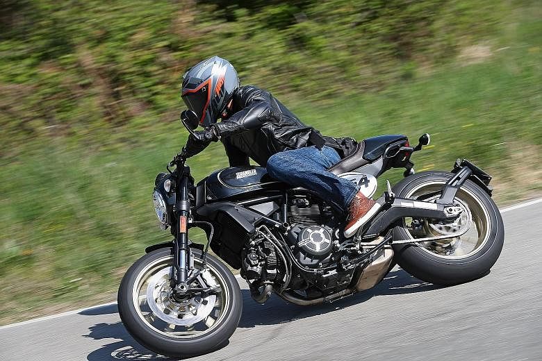 The Ducati Scrambler Cafe Racer (above, with the writer on a 180km test- route in Bologna, Italy) lacks horsepower, but on tight, winding mountain roads, it is easy to handle.