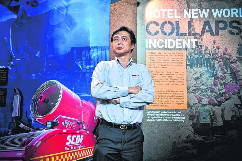 Mr Tan Kim Teck, who was involved in rescue operations during the Hotel New World collapse in 1986, recalling his experience at the SCDF NS Gallery yesterday.