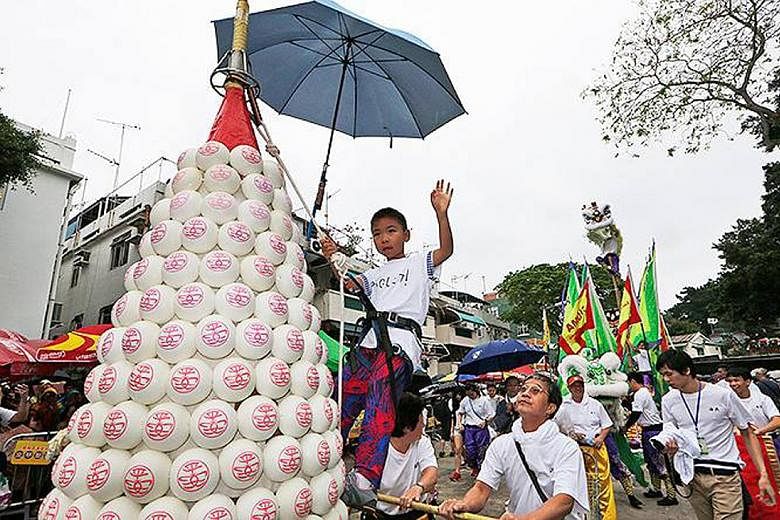 To celebrate the Cheung Chau Bun Festival in Hong Kong, the locals build 20m-tall metal towers covered in buns. Statues of Saint Marie-Jacobe and Saint Marie-Salome are carried in a procession during the annual Pilgrimage of the Gypsies in France.