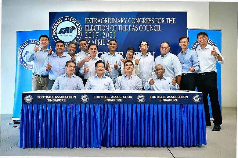 Team LKT in high spirits after their victory in the FAS election was announced yesterday. Top row (from left): Mr Forrest Li, Mr Rizal Rasudin, Mr Yakob Hashim, Dr Dinesh Nair, Mr Kelvin Teo, vice-president Razali Saad, Ms Sharda Parvin, vice-preside
