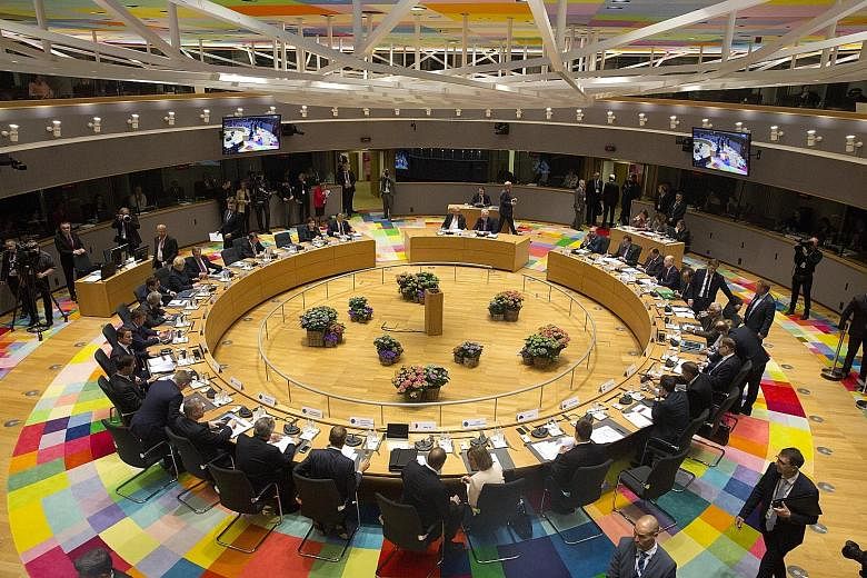 Leaders of the 27 remaining European Union countries met at a special summit in Brussels yesterday and adopted a set of divorce terms for Britain which had been hammered out by their diplomats over the past month.