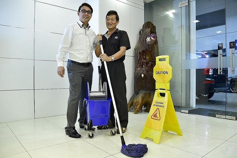 Mr Thomas Ang, 36 , head of operations at Weishen Industrial Services, with Mr Dicky Ong, 60, cleaning services supervisor, at their company's Bukit Batok headquarters.