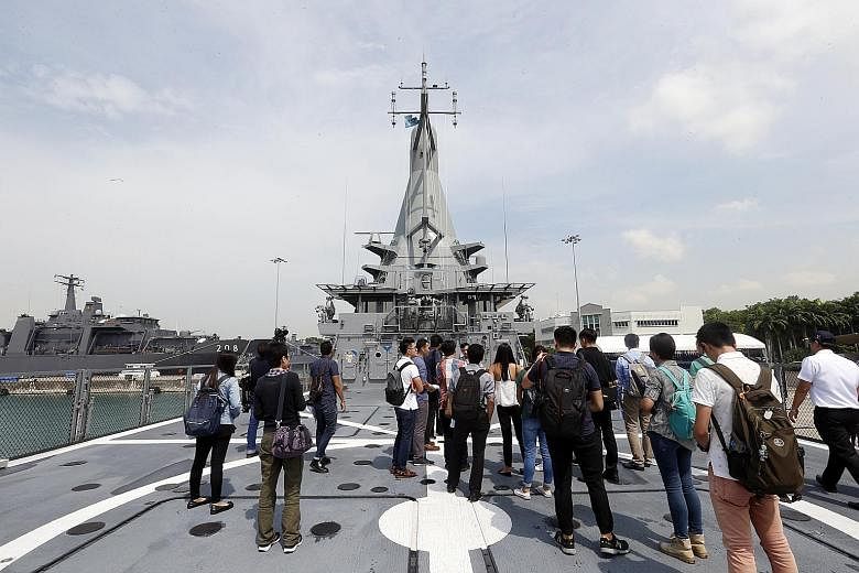 Members of the media on a tour last week of LMV Independence, the first of eight Littoral Mission Vessels designed and built here. Prime Minister Lee Hsien Loong will commission the vessel on Friday, marking 50 years since the Singapore naval ensign 