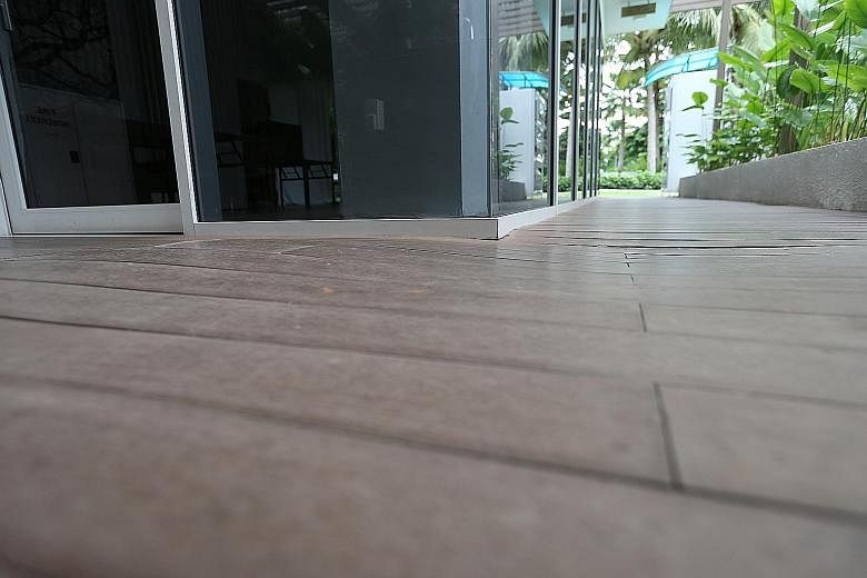 Austville Residences EC has six towers with a total of 540 units. The project obtained its TOP in 2014. Warped wooden floor decking at the executive condominium's clubhouse last June. The management of Austville Residences has paid for it to be recti
