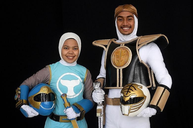 Muslim cosplay enthusiasts Azlyna Zaina (left) and Raja Muhammad Rusydi went to the hijab cosplay event in Kuala Lumpur dressed as characters from Power Rangers. 