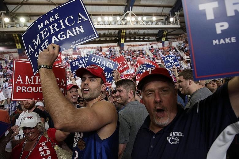 Supporters in Harrisburg, Pennsylvania, where US President Donald Trump held a rally on Saturday. He said under his administration, more than 600,000 new jobs had been created and illegal immigration across the country's southern border has been redu