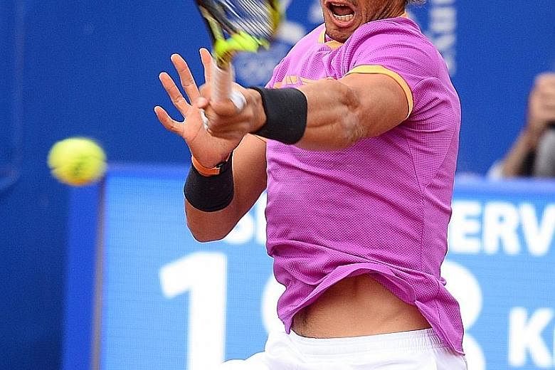 Rafael Nadal whipping a forehand against Austria's Dominic Thiem en route to his 10th Barcelona Open title. The Spaniard won 6-4, 6-1 yesterday, a week after lifting an Open era-record 10th crown at the Monte Carlo Masters. The 14-time Grand Slam cha