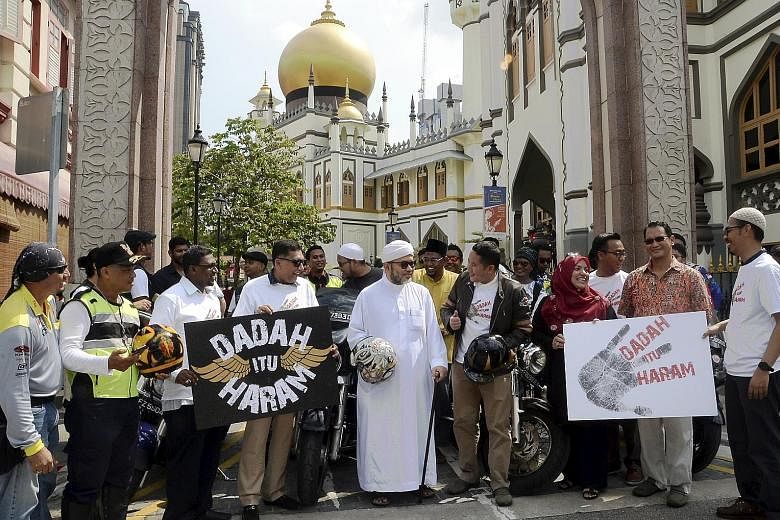 Mr Amrin Amin (wearing jacket), who arrived in a convoy of bikers from 40 motorcycling groups, with Pergas president Mohamad Hasbi Hassan (in white) and representatives of other Malay/Muslim organisations at the launch of "Dadah Itu Haram" (Drugs are