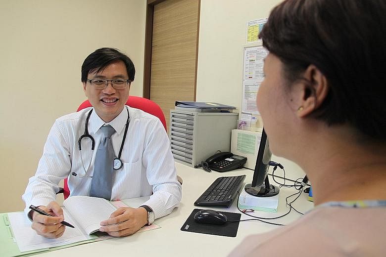 Dr Wei Ker-Chiah, chief of IMH's department of community psychiatry, treating a patient at Queenstown Polyclinic.